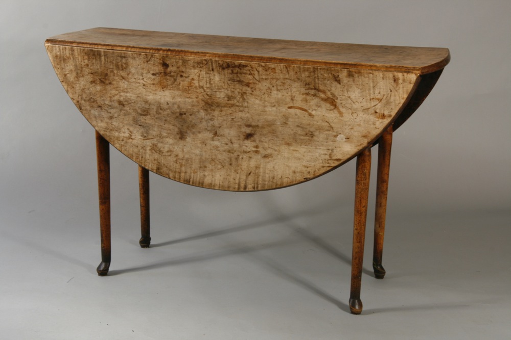 A very fine and unusual Queen Anne drop leaf table