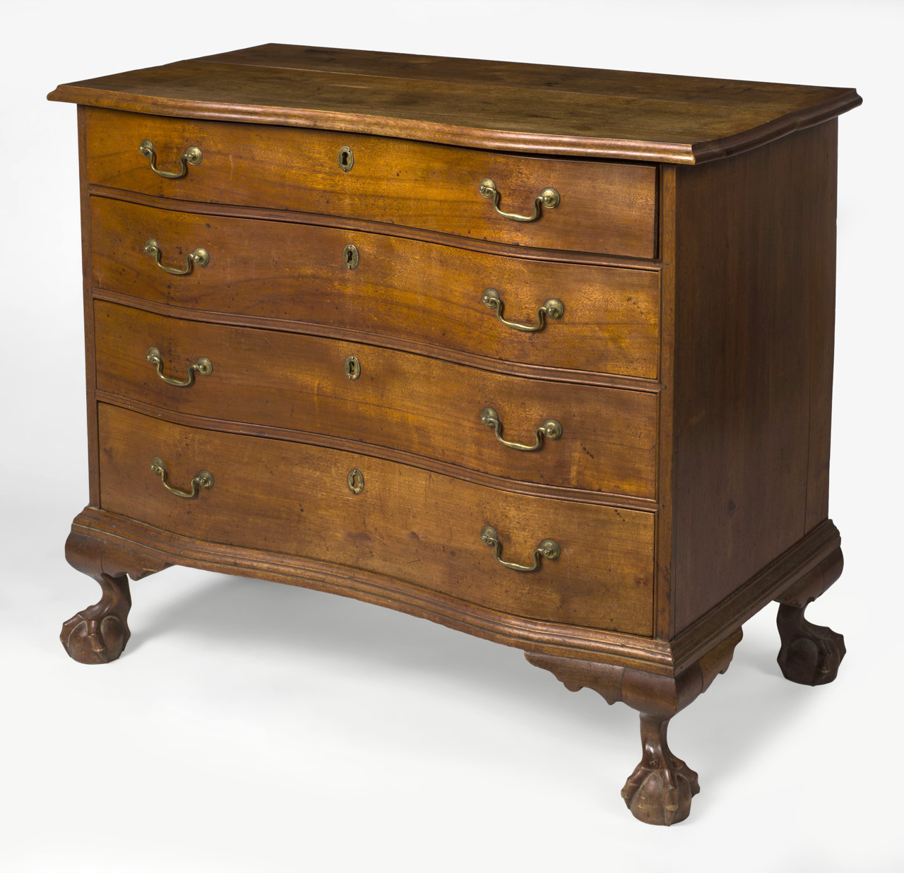 A classic North Shore Chippendale ox-bow or serpentine front chest